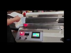 Macchina per incollare la carta sul dorso del blocco del libro